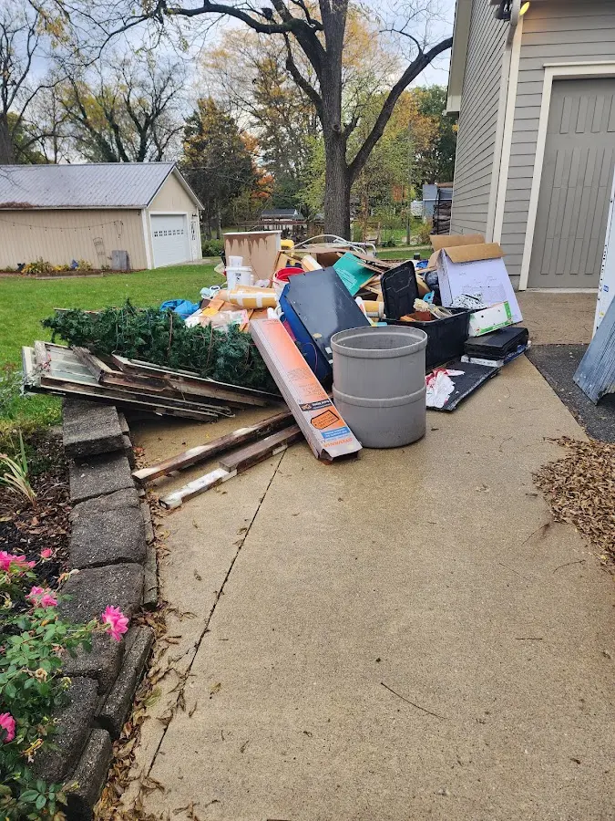 Dumpster being loaded with debris for Estate Cleanout Dumpster Rental in Imperial
